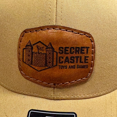 Solid Amber Gold Secret Castle Logo Mesh Richardson 112 Trucker Hat