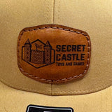 Solid Amber Gold Secret Castle Logo Mesh Richardson 112 Trucker Hat